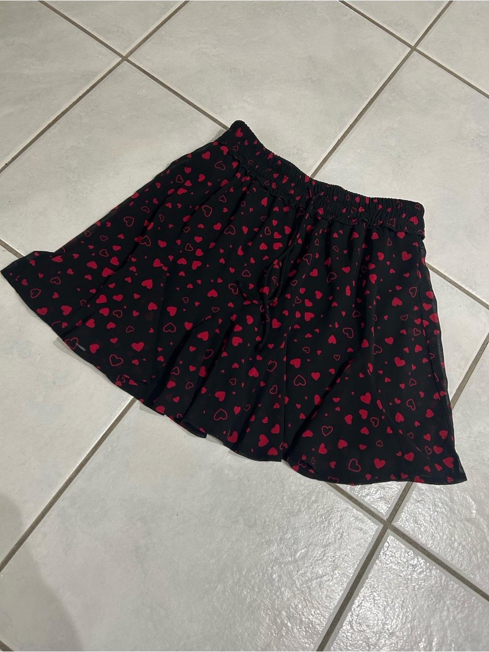 Francesca's Collections Black Mini Skirt with Red Heart Print